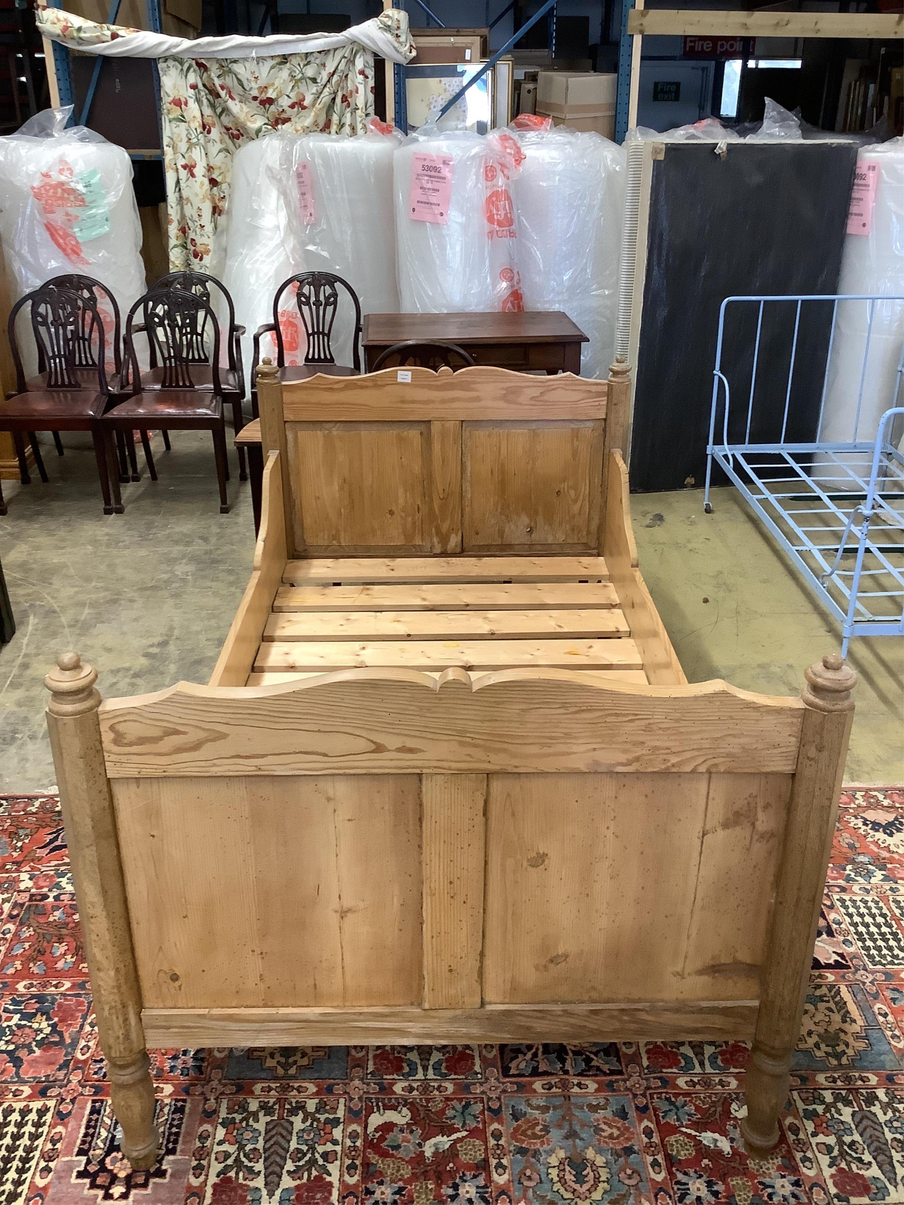 A 19th century Continental pine single bed frame, width 110cm, length 199cm, height 99cm